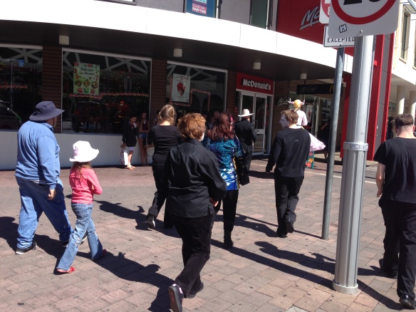 The walking tour continues past McMuck and The Bus Interchange, led by the antler girl on stilts