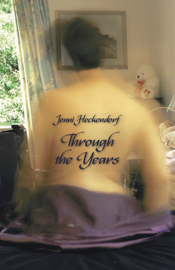 A book cover of Jenni Heckendorf's memoir Through the Years, a self portrait, her back with the title on it and the image is blurred slightly to depict her movements, a tasteful and sensuous image.